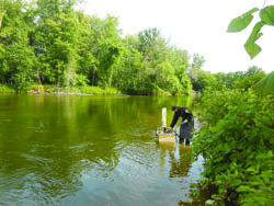 U.S. Fish and Wildlife service sea lamprey control agent conducting a lampricide application on a great lakes tributary